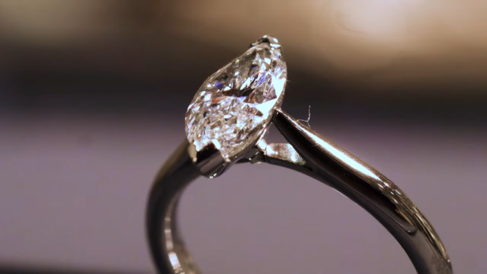 What is a hidden halo diamond engagement ring